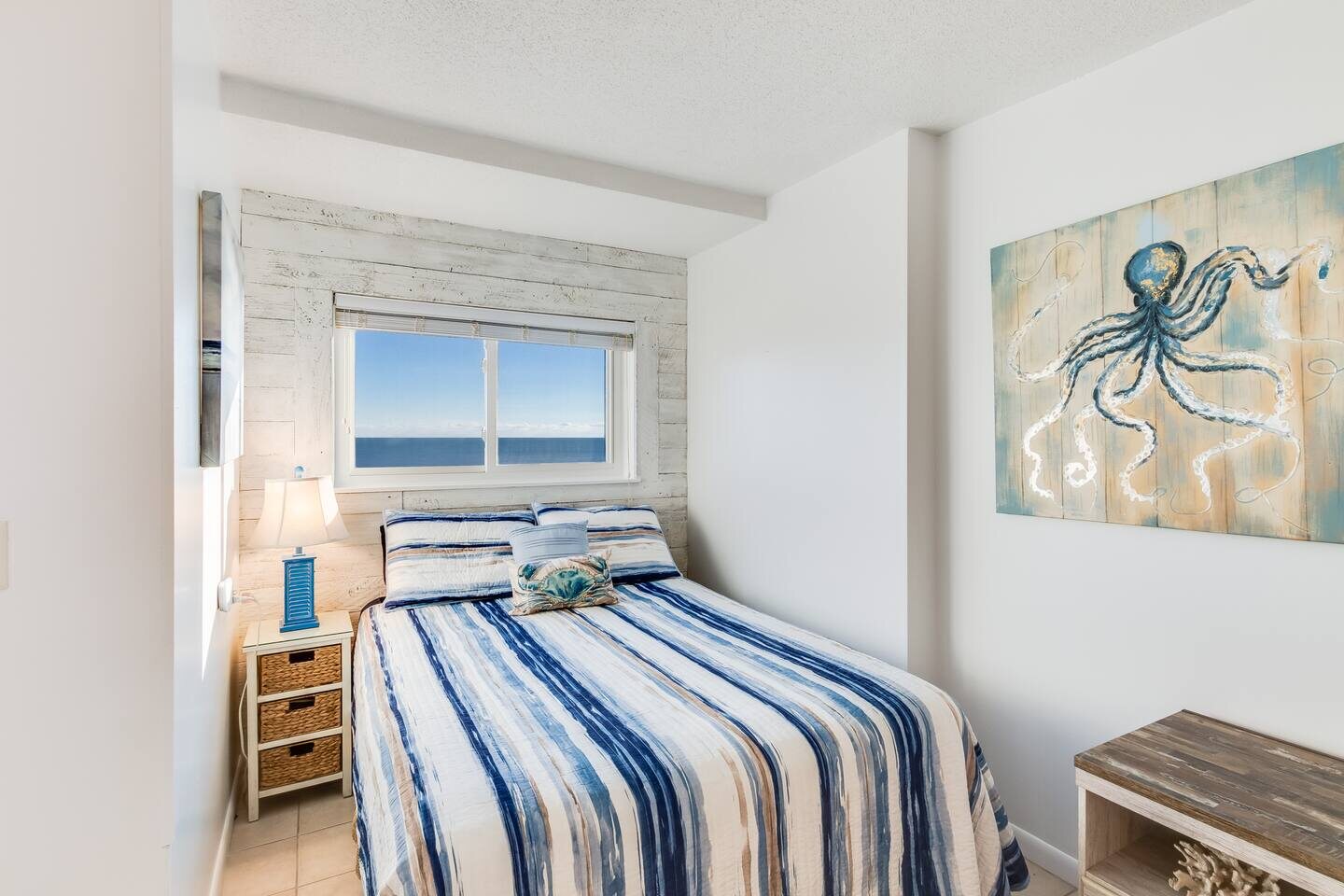 The queen bed in The Seaside Suite